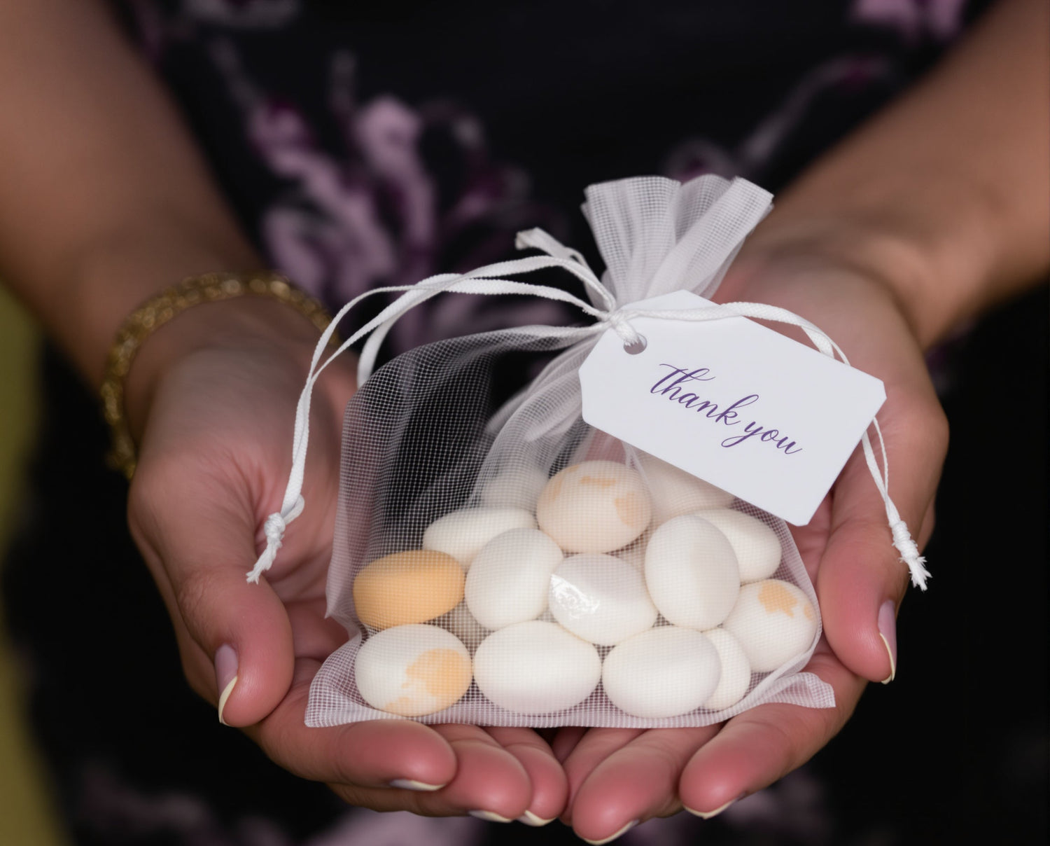 Wedding Bomboniere includes sugared almonds in an organza back with a thankyou tag
